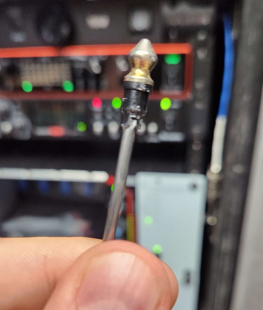 The broken off piece of the headphone plug stuck on the nail and successfully removed from the mixer.